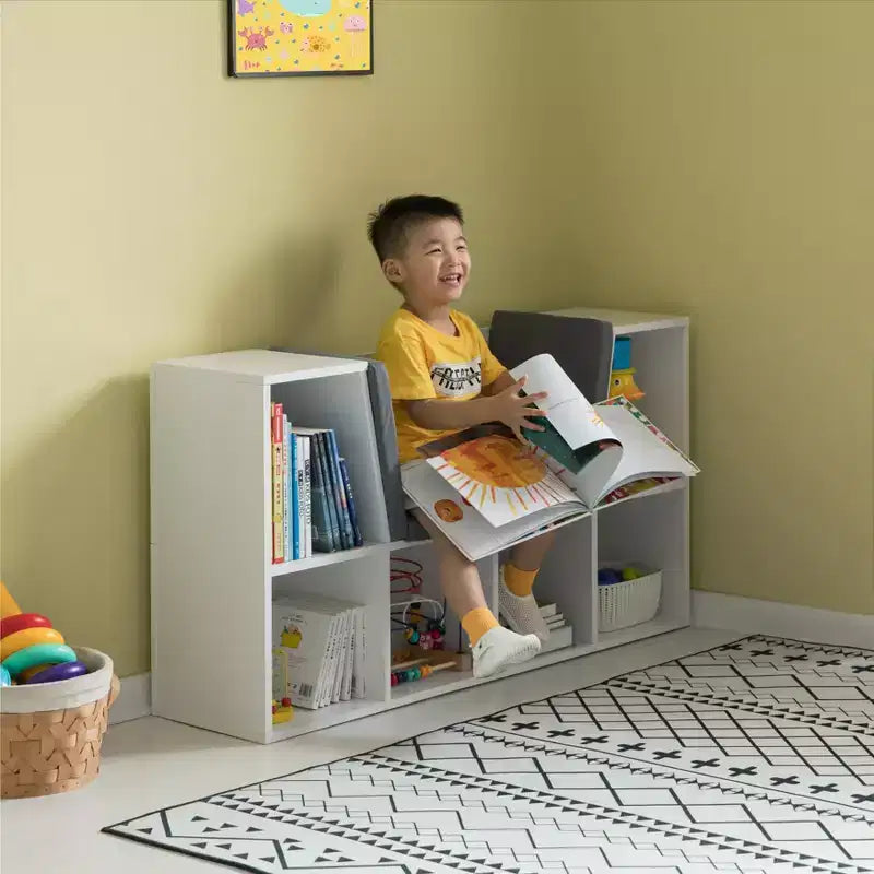 Étagère multifonction moderne avec espace de rangement et coin lecture rembourré gris