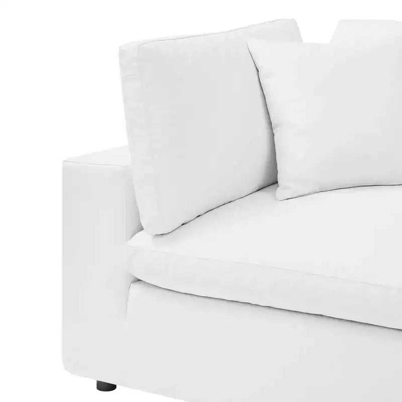 Fauteuil d'angle rembourré en similicuir garni de duvet
