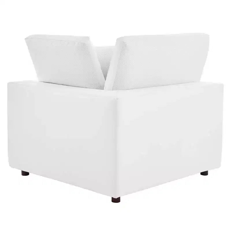 Fauteuil d'angle rembourré en similicuir garni de duvet